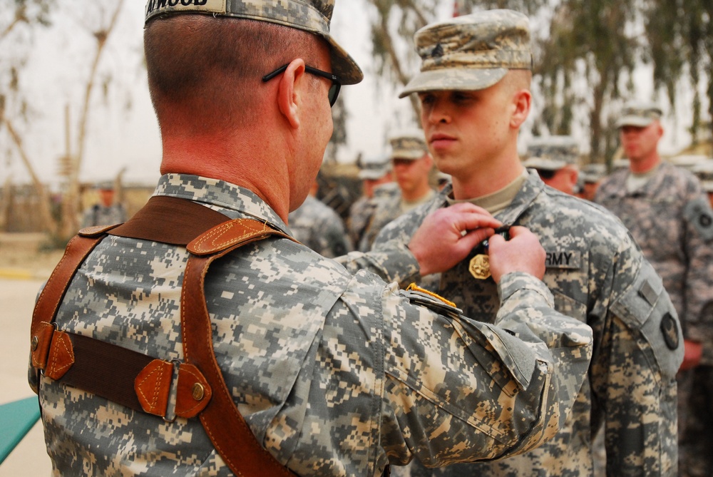 Sgt. Greg D. Opoien Receives Army Achievement Medal in Iraq