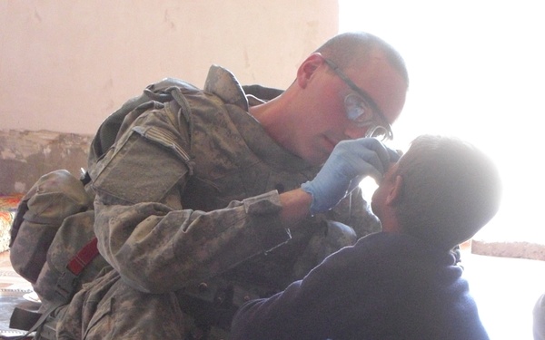 Gaining trust one boo-boo at a time: Medic treats children in Taji