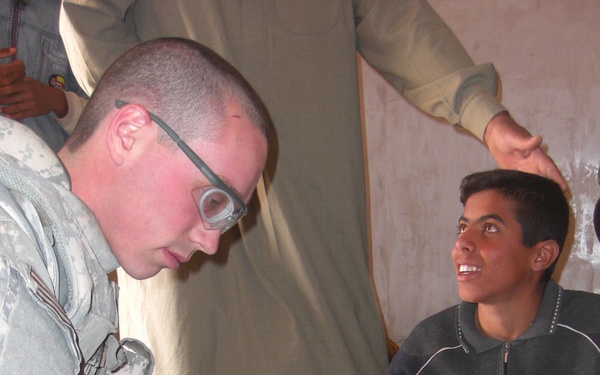 Gaining trust one boo-boo at a time: Medic treats children in Taji