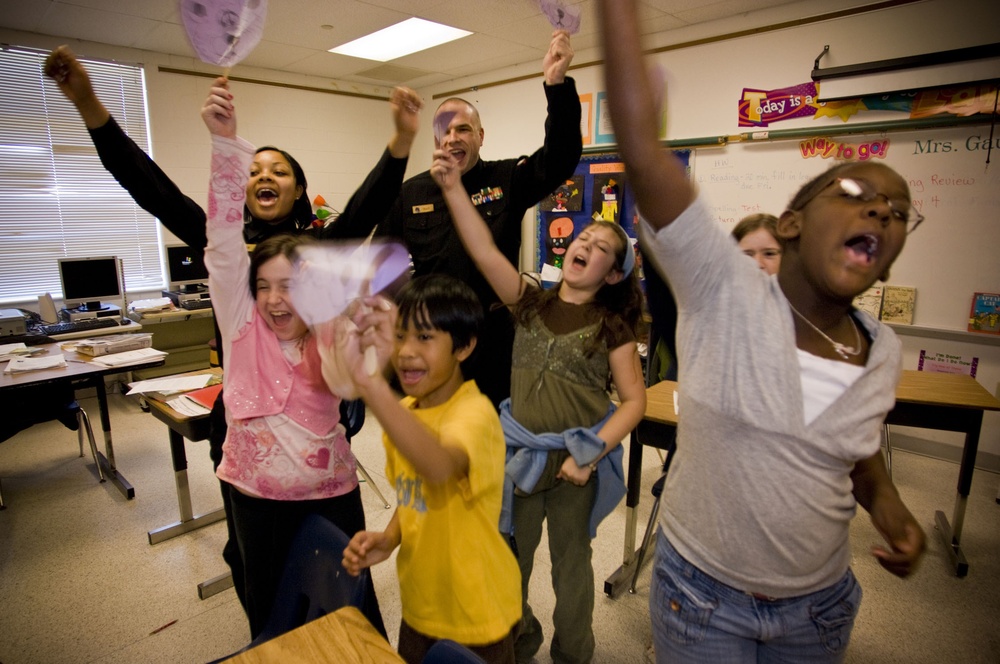 Sailors read to children at Bayside Elementary