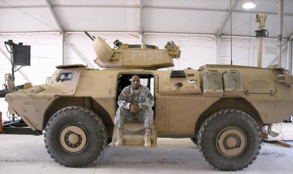 Sitting in an armored security vehicle