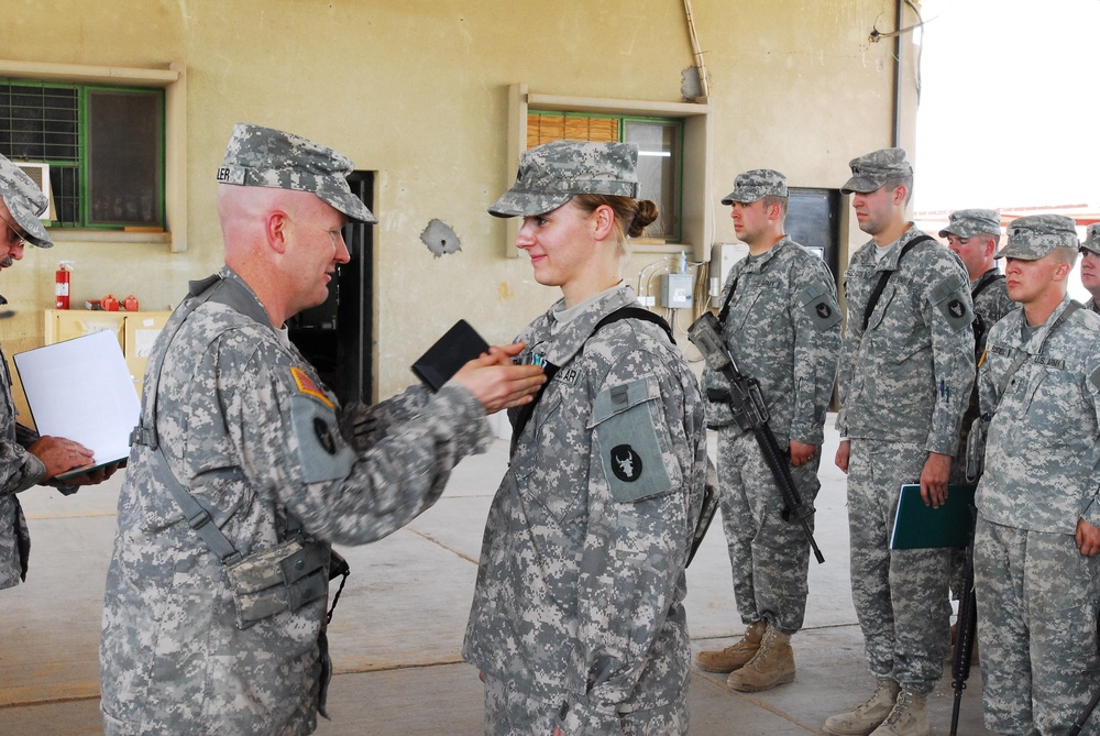 Headquarters and Support Company 834th Aviation Support Battalion Soldier Receives Service Award in Iraq