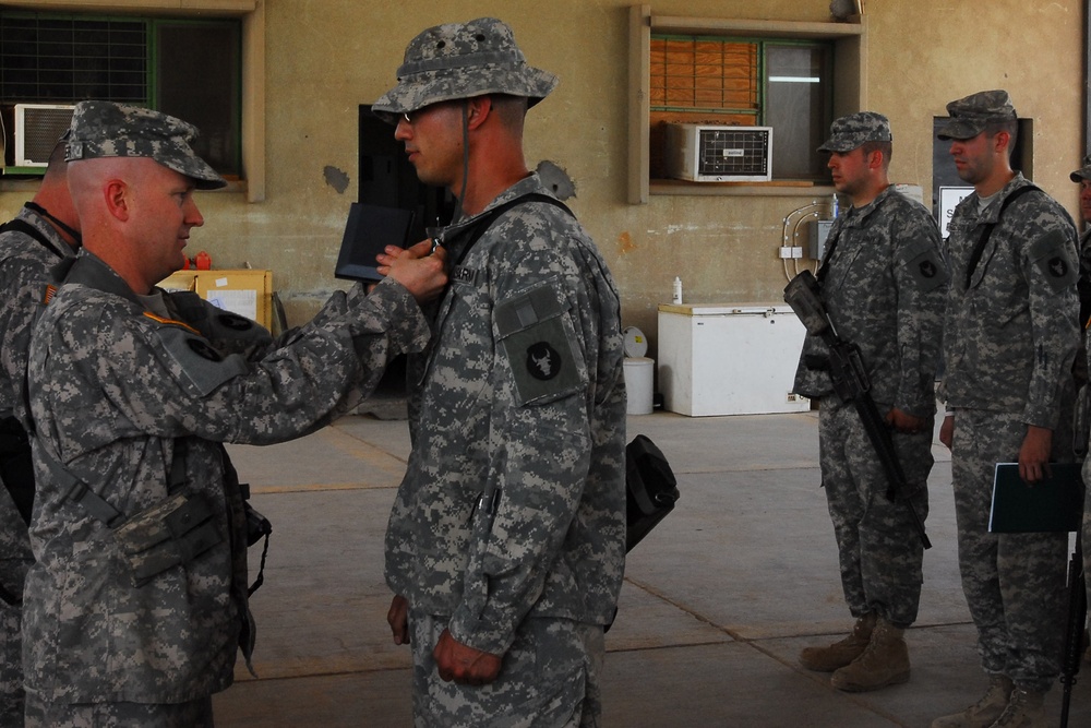 Headquarters and Support Company 834th Aviation Support Battalion Soldier Receives Service Award in Iraq