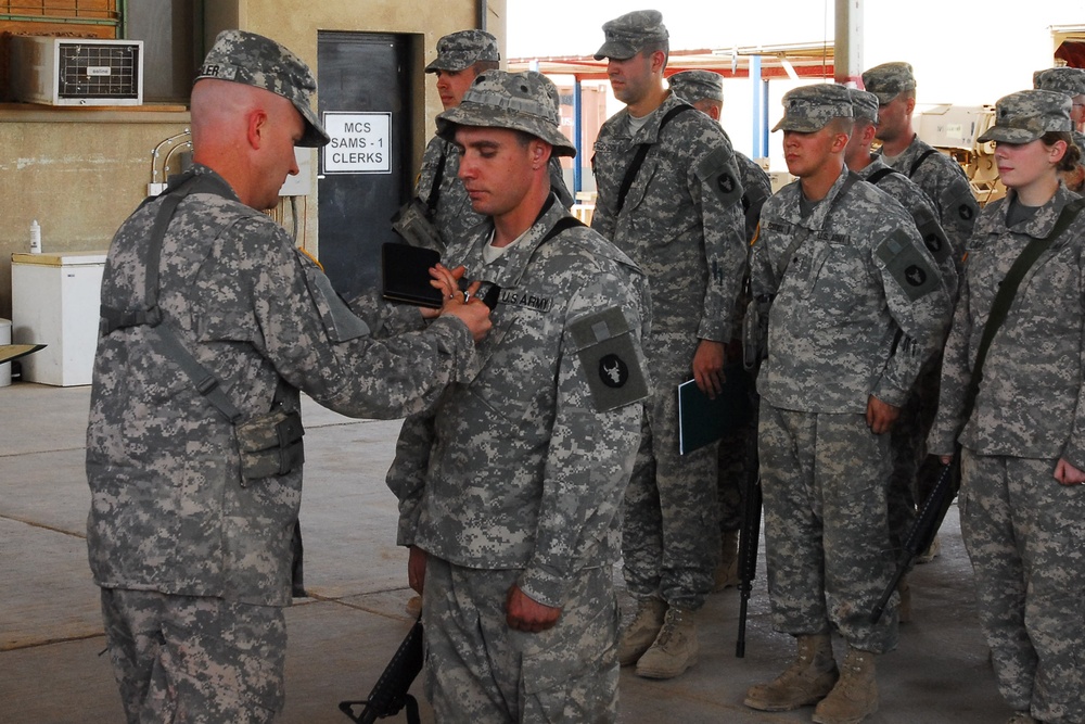 Headquarters and Support Company 834th Aviation Support Battalion Soldier Receives Service Award in Iraq