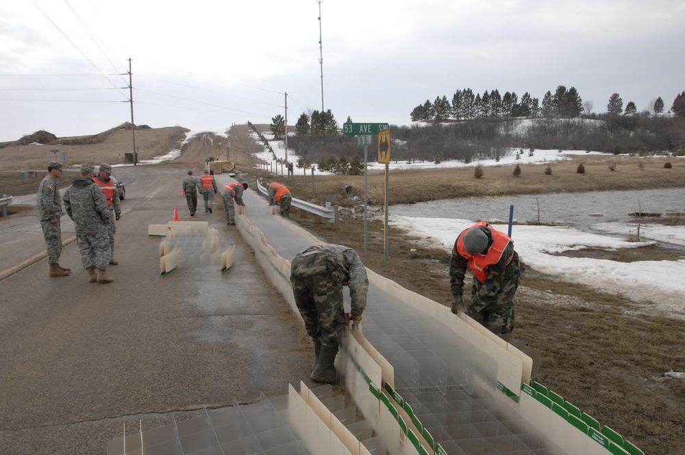 North Dakota National Guard Soldiers help with flooding in Burlington