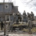 North Dakota National Guard Soldiers sandbag the Olson house