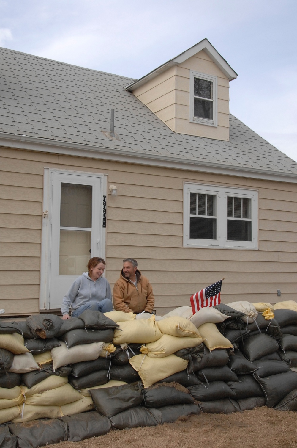 North Dakota National Guard Soldiers sandbag the Schmidt house