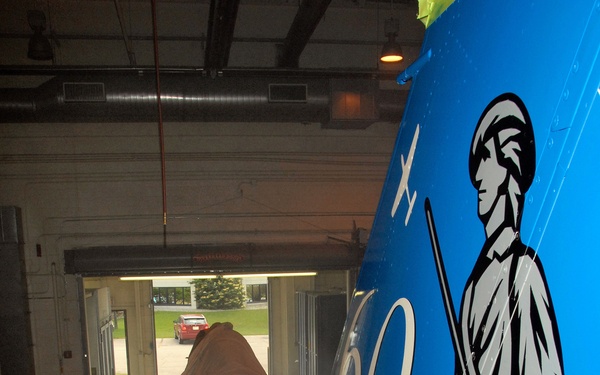 Wisconsin Air Guard Craftsman Applies Anniversary Tail Art to F-16