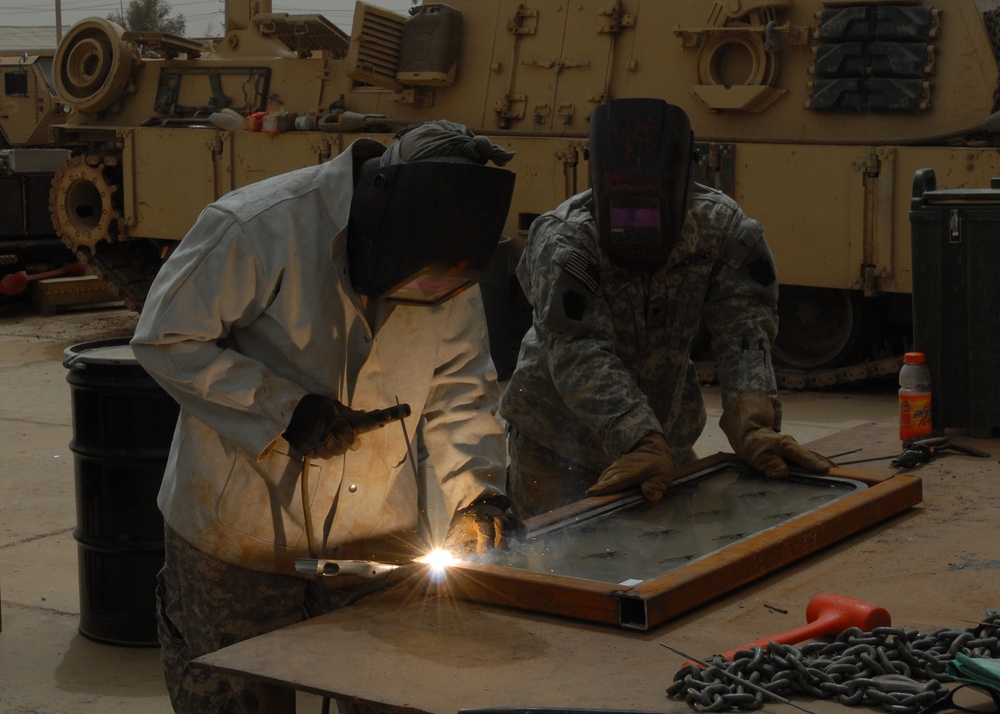 Welding together a defense: Soldiers install low-cost add-ons to vehicles