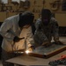 Welding together a defense: Soldiers install low-cost add-ons to vehicles