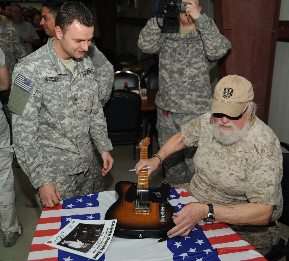 Charlie Daniels performs for Joint Base Balad service members, autographs guitars