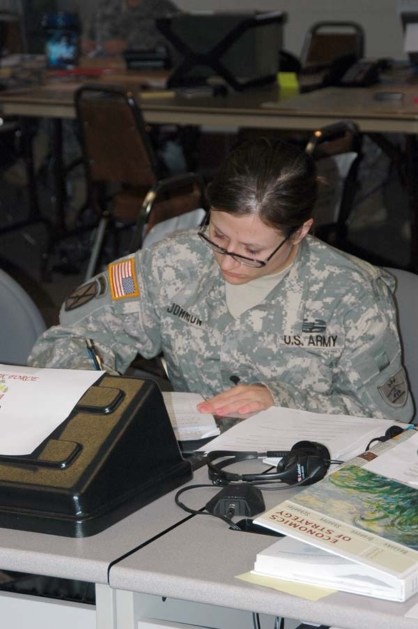 Giving it the Ol' College Try - Guard Members Keep up with Studies While Away from Classroom Fighting Floods