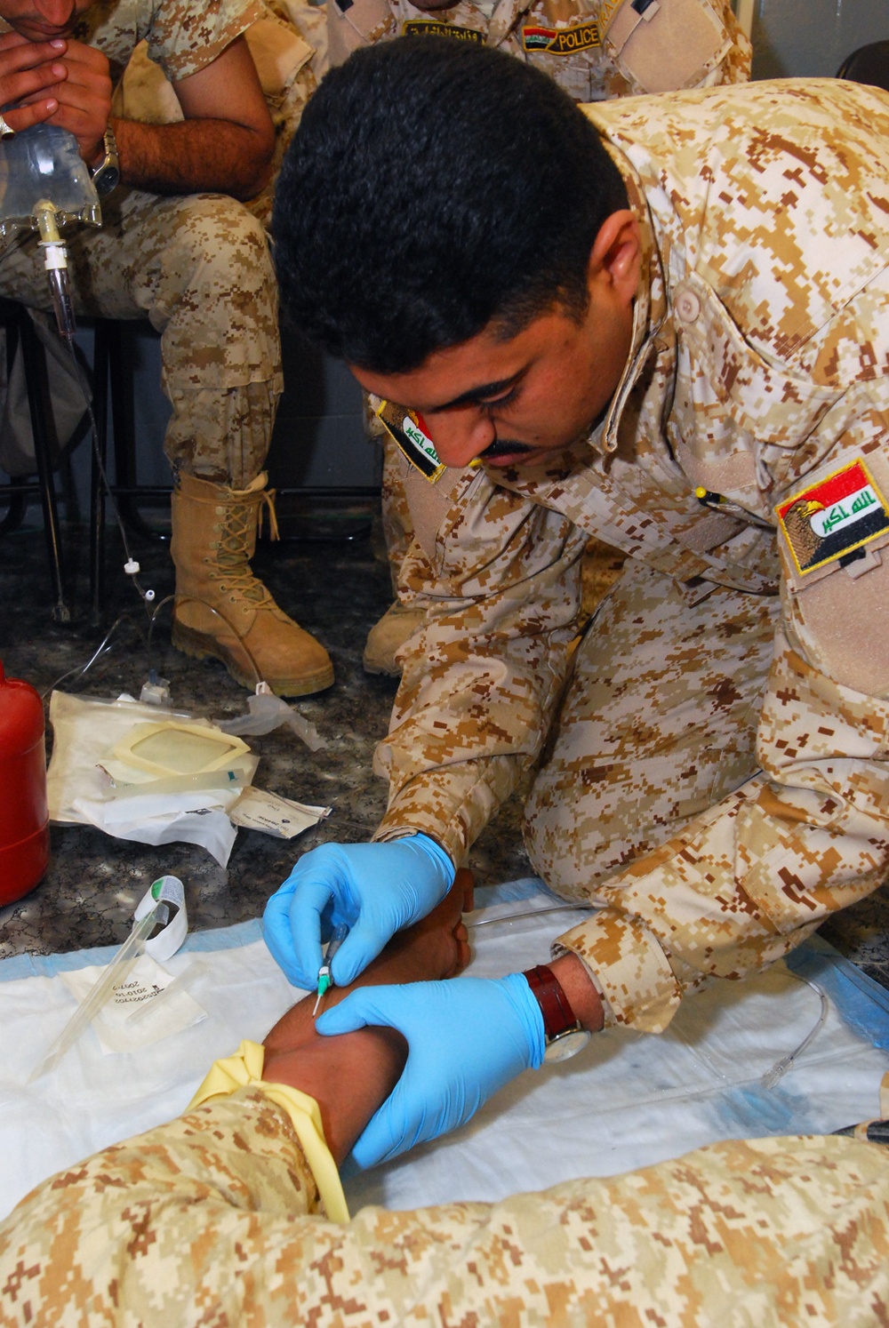 Iraqi police graduate medic training at Forward Operating Base Delta