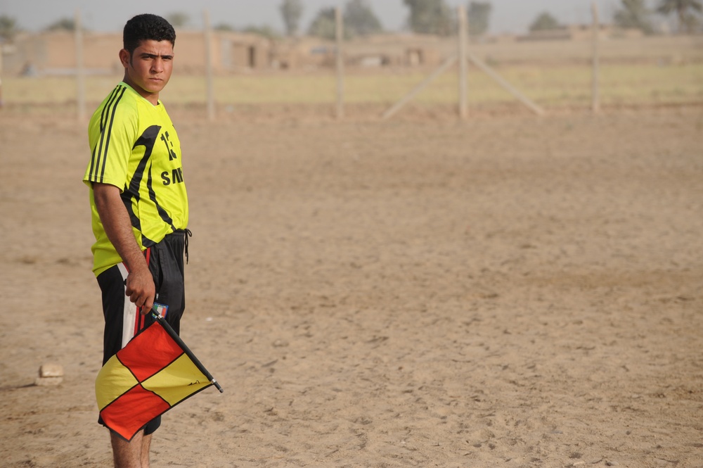 Assessing soccer fields in Baghdad