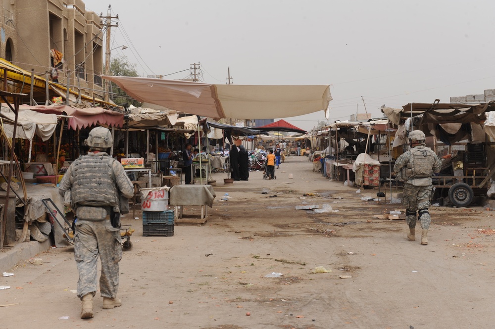 U.S., Iraqi forces patrol through Dora in Baghdad