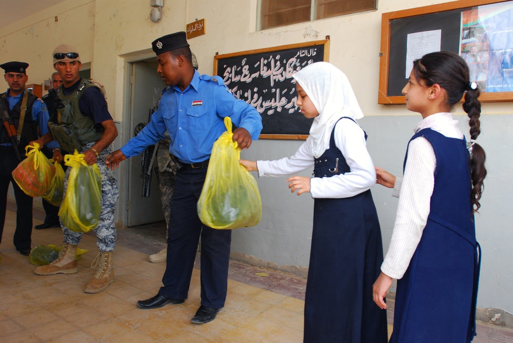Soldiers, Iraqi police partner to improve community relations