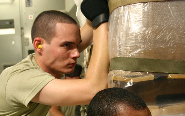 Airmen unload medical supplies to fight swine flu in Central America