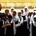 Iraqi forces give new school supplies to students