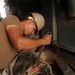 Young Navy Seabee's Get Vital On The Job Training From Mentors And On Old Dozer