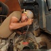 Young Navy Seabee's Get Vital On The Job Training From Mentors And On Old Dozer