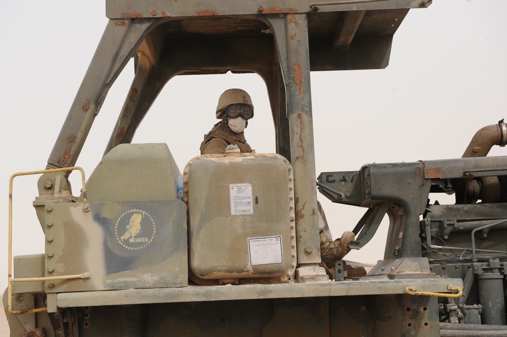 Young Navy Seabee's Get Vital On The Job Training From Mentors And On Old Dozer