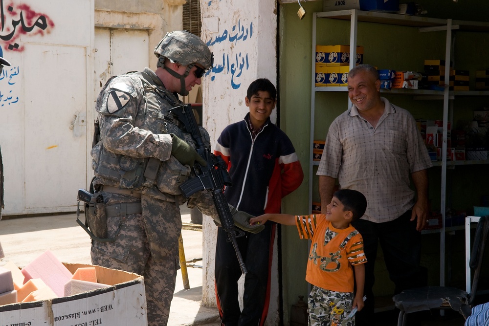 Cavalrymen, Iraqi police patrol Taza