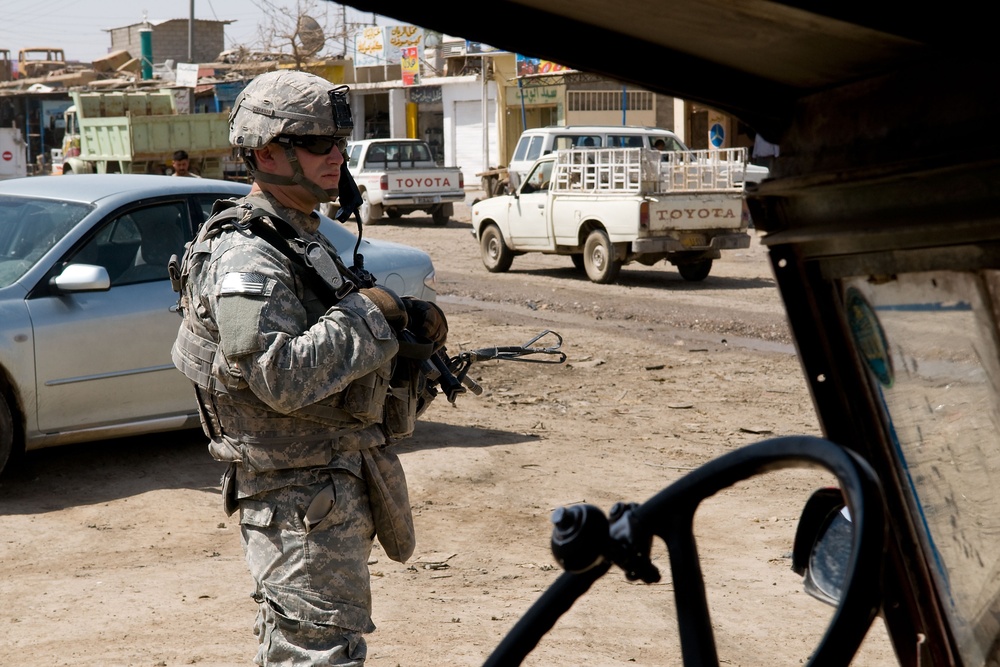 Cavalrymen, Iraqi police patrol Taza