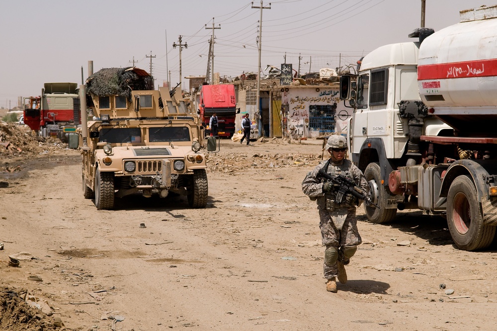 Cavalrymen, Iraqi police patrol Taza