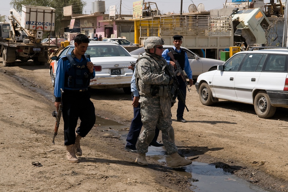 Cavalrymen, Iraqi police patrol Taza