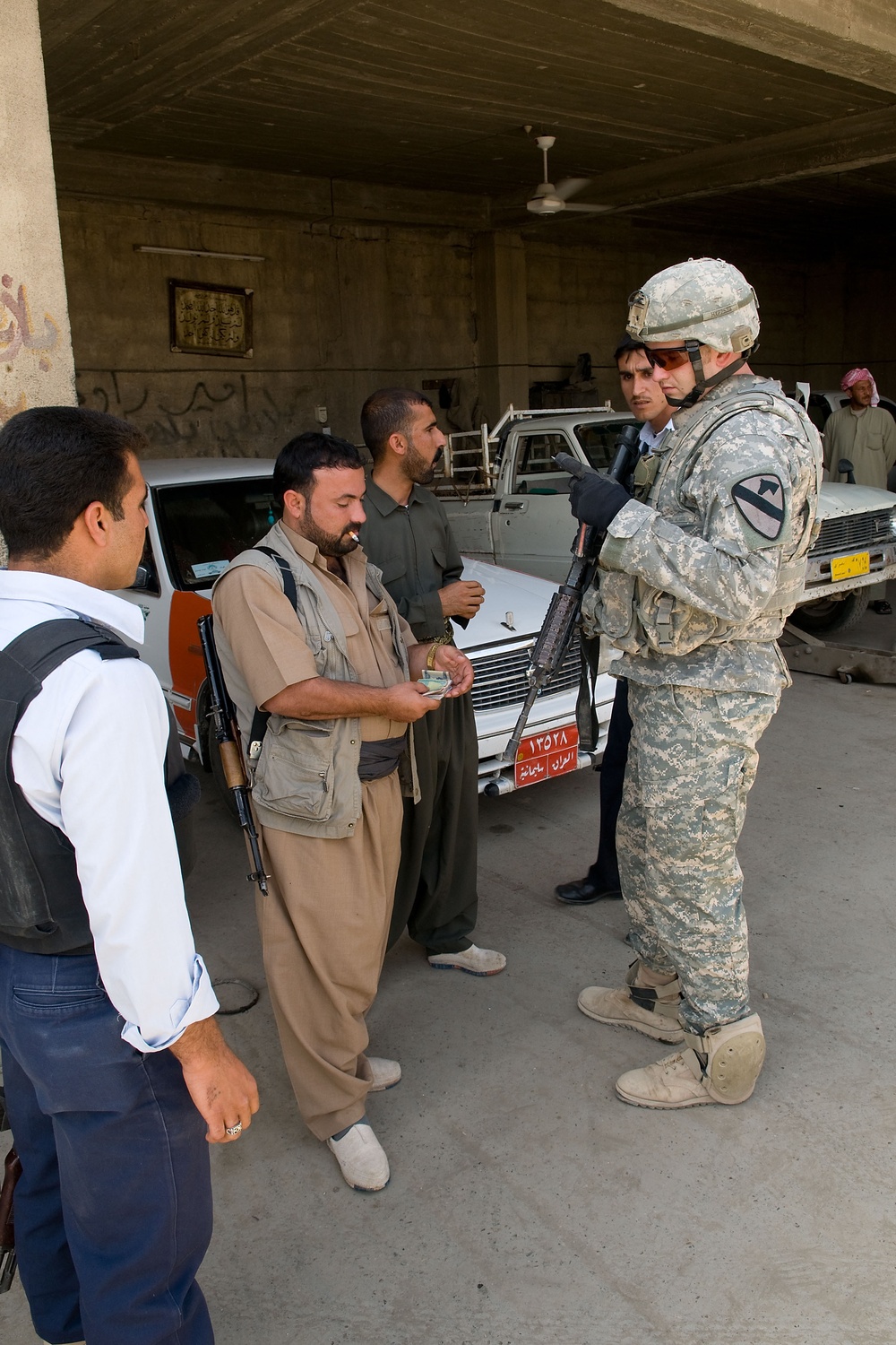 Cavalrymen, Iraqi police patrol Taza