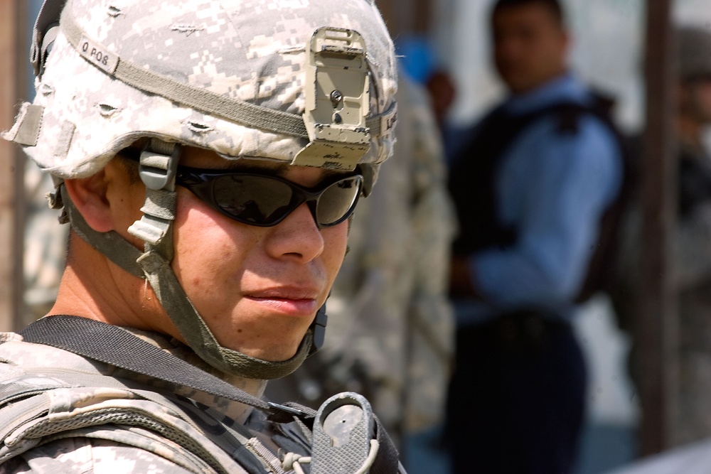 Cavalrymen, Iraqi police patrol Taza