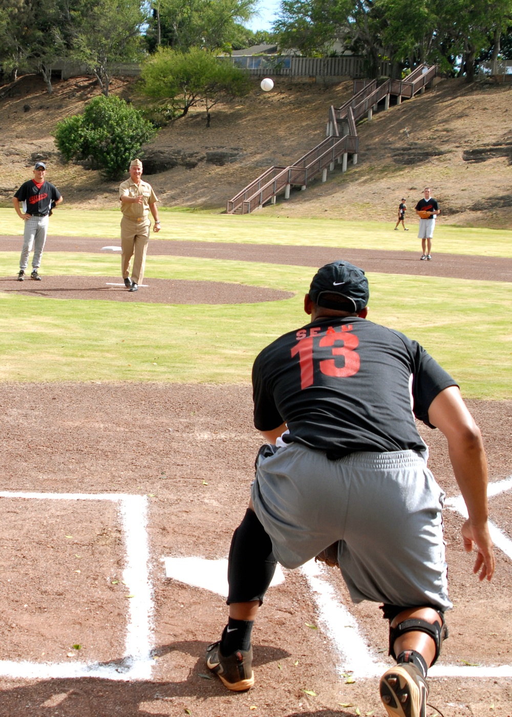 Rear Adm. Joseph Walsh makes first pitch