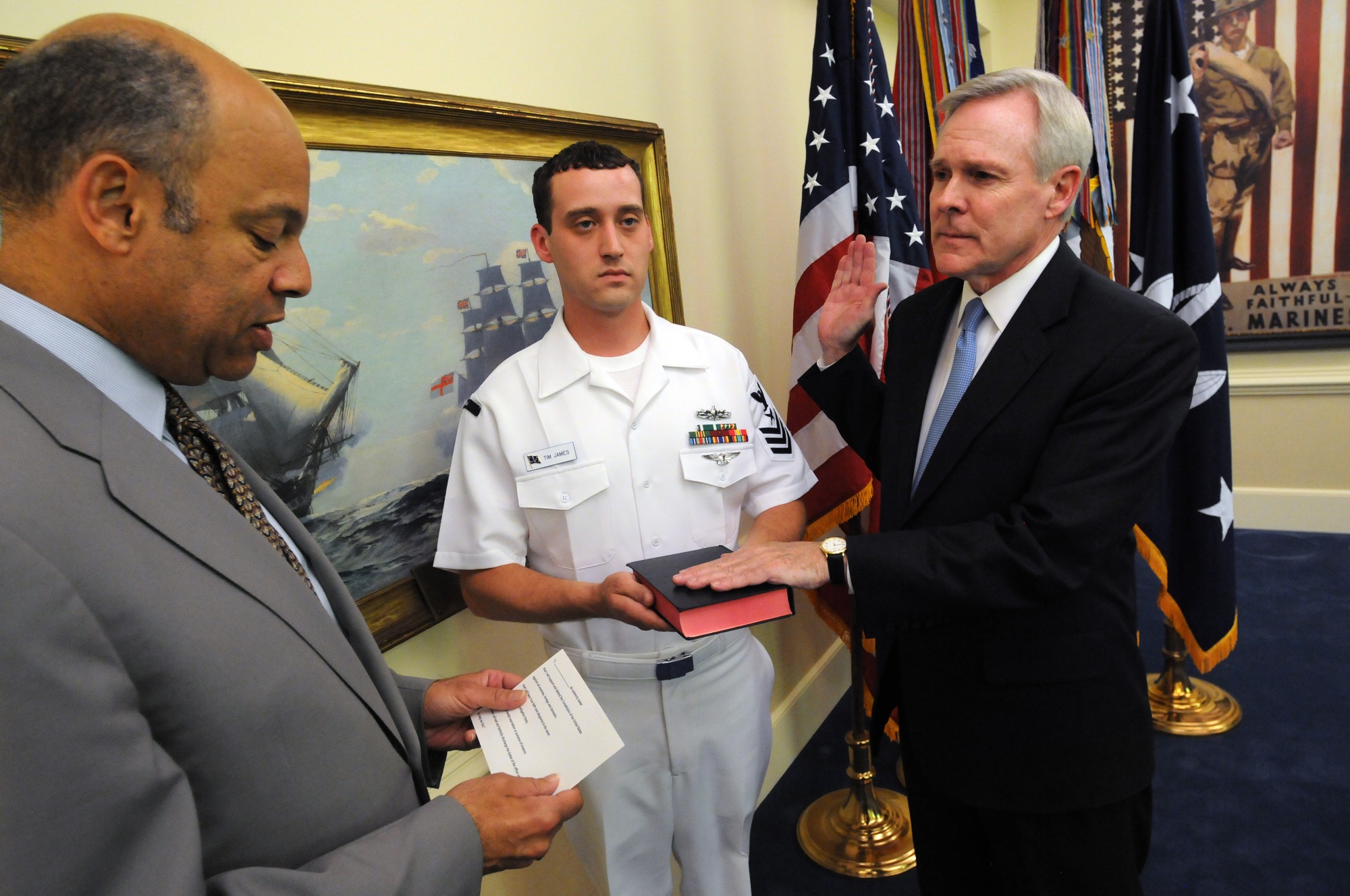 Navy Secretary Ray Mabus shakes the hands of the female service