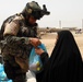 Cavalry Soldiers help Firra Shia villagers during food drop