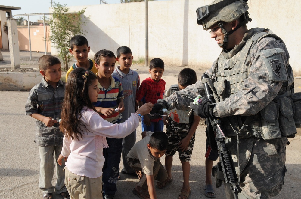 Paratroopers deliver soccer equipment to Rusafa