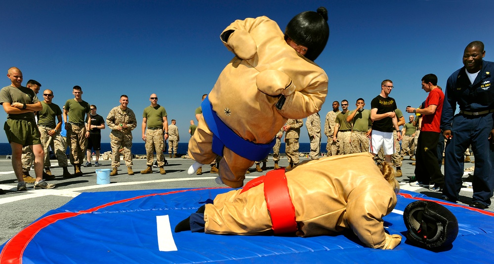 Wrestling in Sumo Suits during Steel Beach Picnic