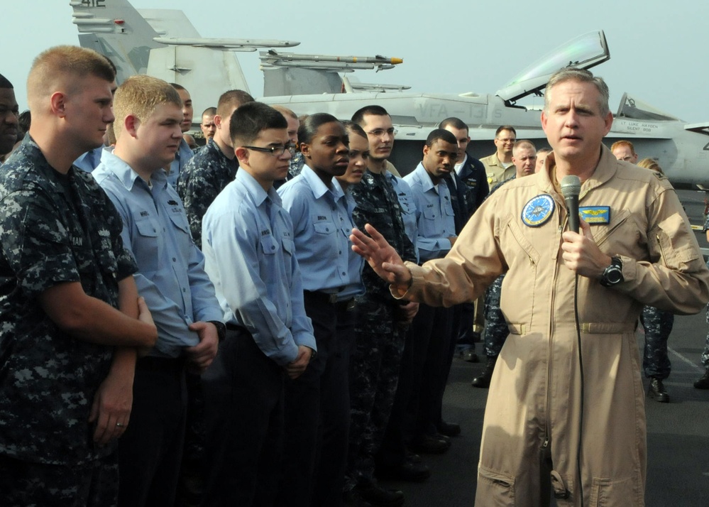 Eisenhower commanding officer speaks to Sailors