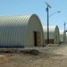 Twelve Dallas Reservists Build Three Steel Barracks in Two Weeks