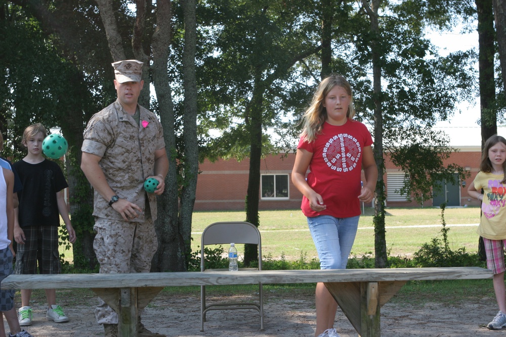 Off the ship, into the playground: Marines assist field meet at local elementary school