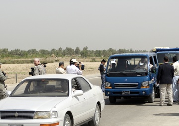 Iraqi Public Gains Highway Access: Convoy Managers Adjust for Lane Loss