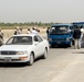 Iraqi Public Gains Highway Access: Convoy Managers Adjust for Lane Loss