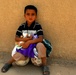 Soccer balls and dolls; Americans make Iraqi children smile