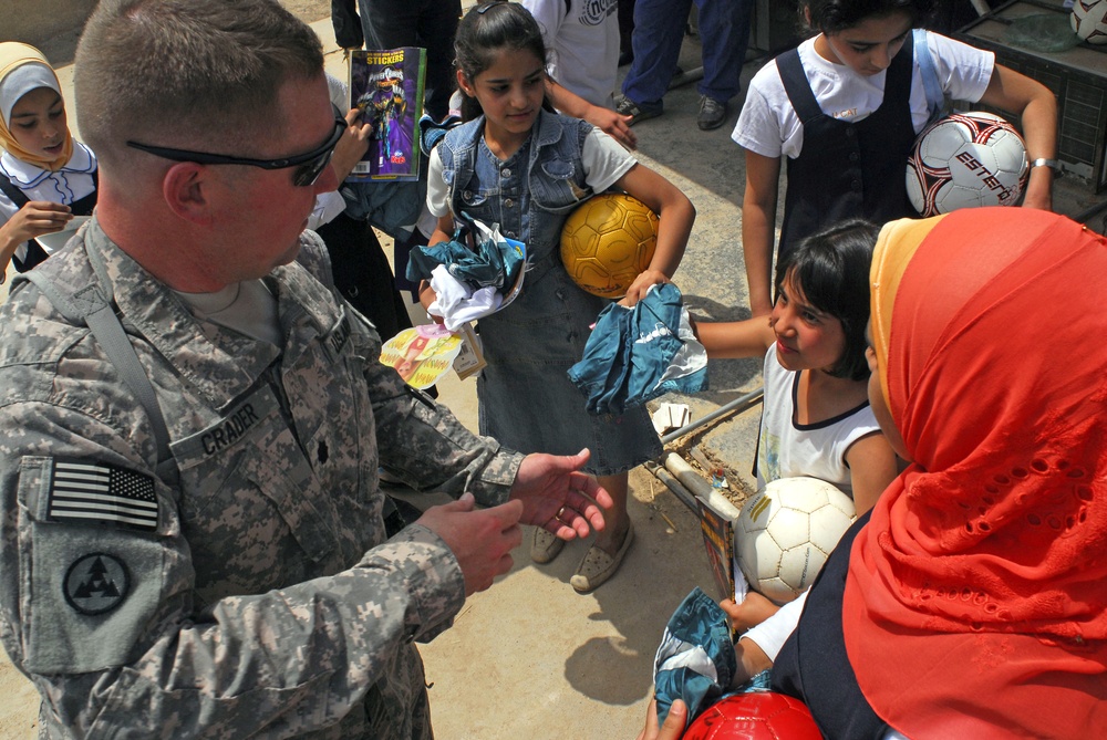 Soccer balls and dolls; Americans make Iraqi children smile