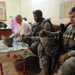 U.S. Soldiers speak with Iraqi security force leaders in Baghdad