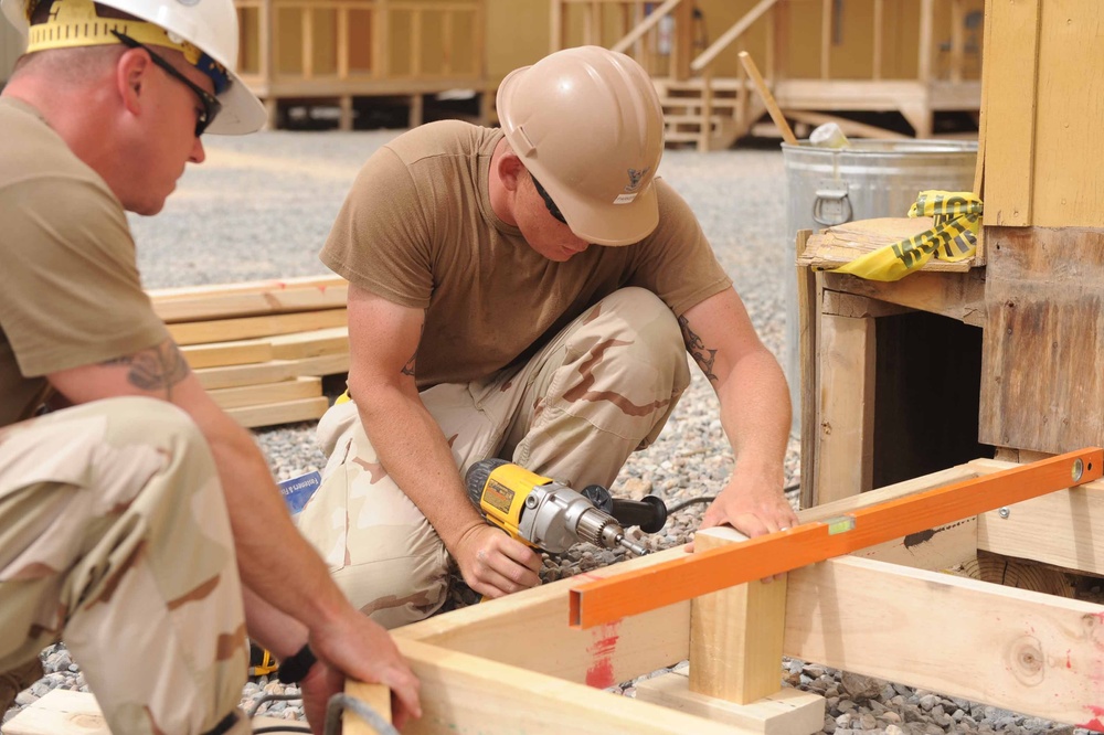 Seabee's hard at work in 115 degree weather at Camp Moreell