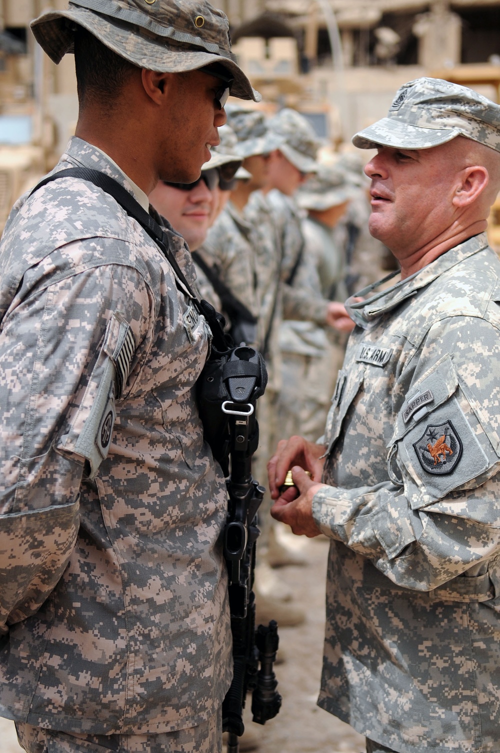 Command Sgt. Maj. Wilson Coins Soldiers in Baghdad, Iraq