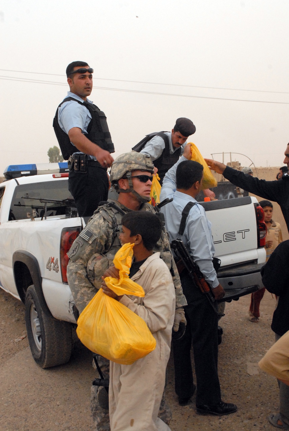 Iraqi and U.S. Soldiers deliver food, soccer balls in Kirkuk province