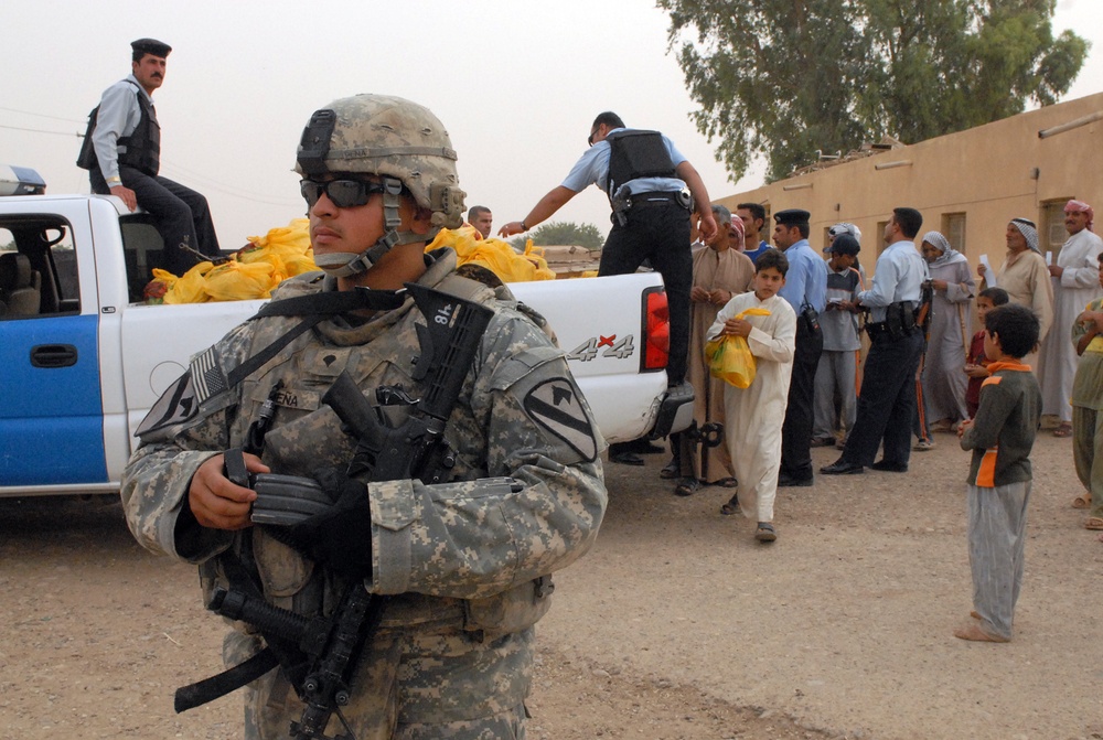 Iraqi and U.S. Soldiers deliver food, soccer balls in Kirkuk province