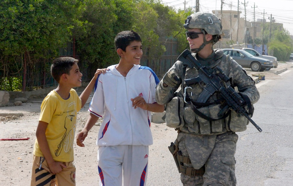Military Police paratroopers patrol along main Baghdad highway