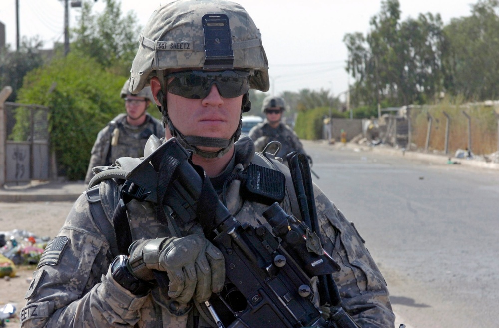 Military Police paratroopers patrol along main Baghdad highway